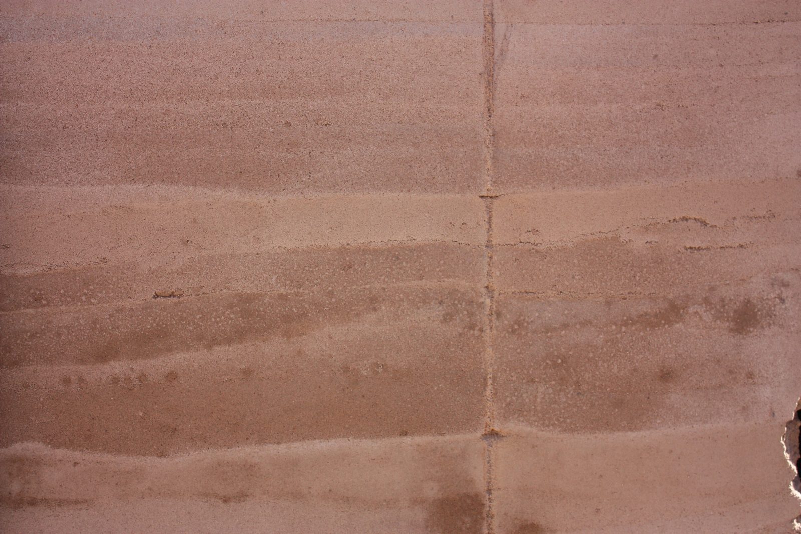 Close-up of the horizontal layers in a rammed-earth wall